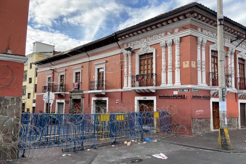 Photo of barricades enforced with rolls of barbed wire blocking a street in Quito, Ecuador's historic center during the October, 2019 protests