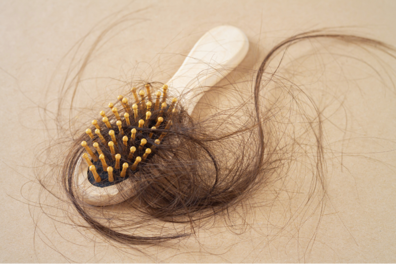 Hair brush with a lot of loose hair in the bristles